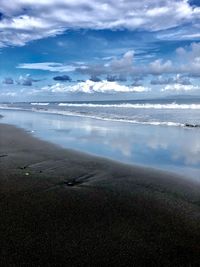 Scenic view of beach against sky