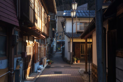 Street amidst buildings in city at night