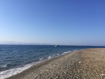 Scenic view of sea against clear blue sky