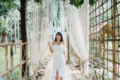 Woman standing in a forest