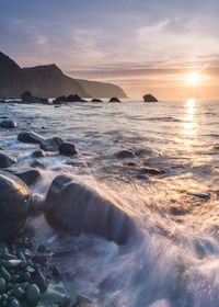 Scenic view of sea against sky during sunset