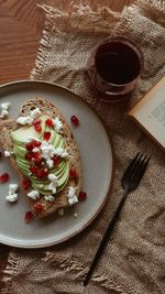 Avocado toast with pomegranate and goat cheese toppings