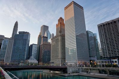 Modern buildings in city against sky