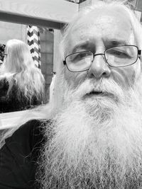 Close-up portrait of man wearing eyeglasses