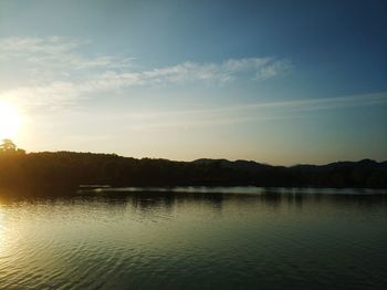 Scenic view of lake against sky during sunset