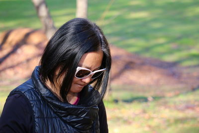 Portrait of young woman wearing sunglasses