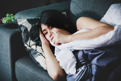 Young woman sitting in car
