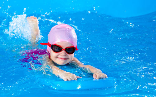 Portrait of woman swimming in pool