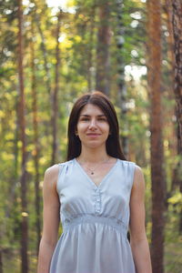 Portrait of a beautiful young woman in forest