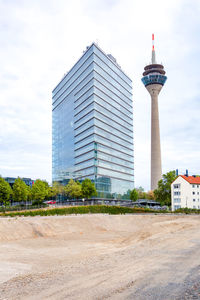 View of buildings against cloudy sky