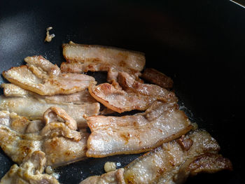 High angle view of meat in cooking pan