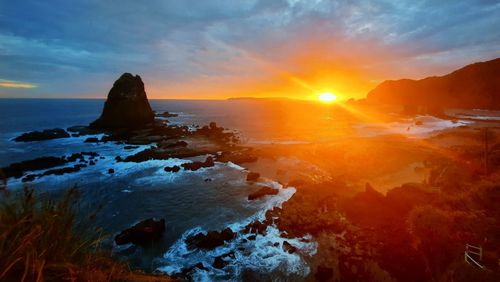 Scenic view of sea against sky during sunset