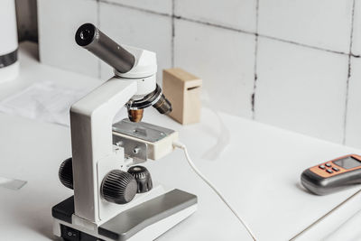 Microscope symbolizing precision, careful analysis required in scientific fields, biology, chemistry