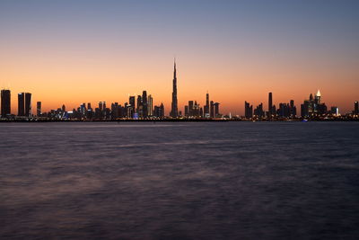 Dubai skyline from dubai creek harbour and dubai canal to downtown and business bay, uae