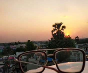 View of sunset seen through car windshield