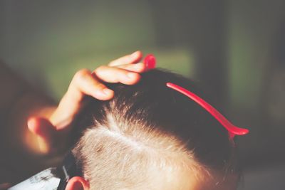 Close-up of baby girl hair with red clip