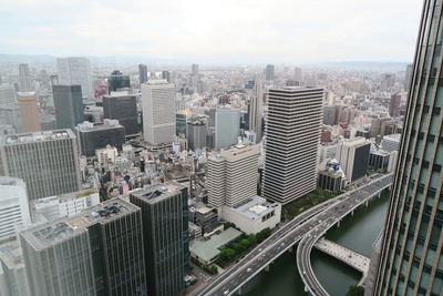 High angle view of buildings in city against sky