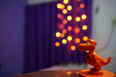 Close-up of illuminated candles on table