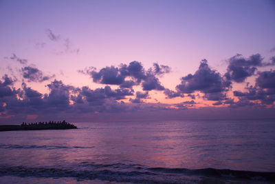 Scenic view of sea against sky at sunset