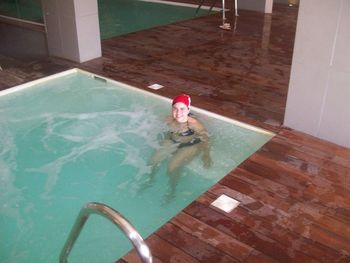 High angle view of woman swimming in pool