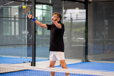 Full length of man playing with ball