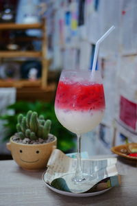 Close-up of cocktail with drink on table