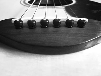 Close-up of guitar on table