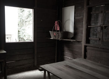 Man standing by glass window on table