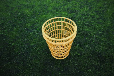 High angle view of wicker basket on field