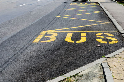 High angle view of arrow sign on road