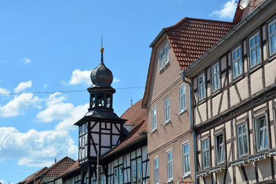 Bell tower from the town hall in ostheim vor der rhoen, bavaria, germany with house facades