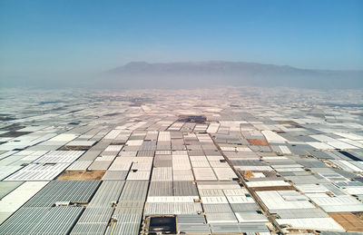 Aerial view of landscape against clear blue sky