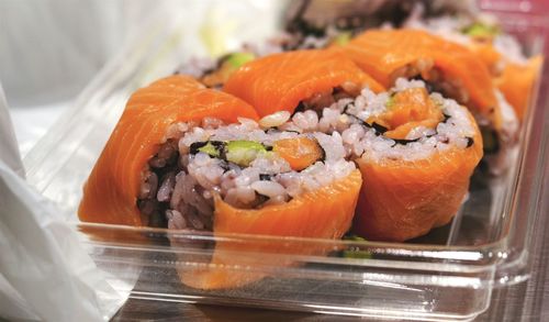 High angle view of orange sushi in disposable plate