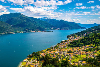 Scenic view of sea and mountains against sky