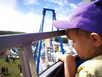 Close-up of child on boat against sky