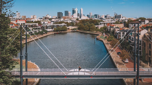 High angle view of bridge over river against buildings in city