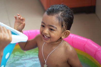 Portrait of smiling girl in swimming pool