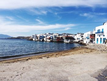View of city against cloudy sky