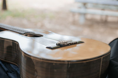 Close-up of guitar on table