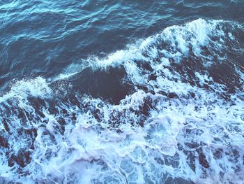 High angle view of water flowing in sea