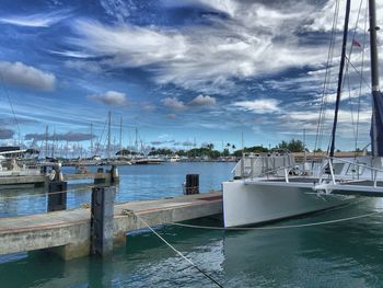 Boats moored at harbor