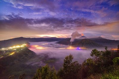 Scenic view of landscape against sky at night