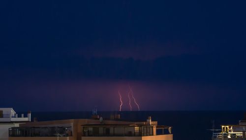 Illuminated buildings in city at night