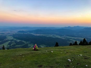 Scenic view of mountains against sky during sunset
