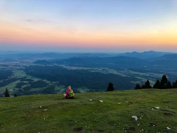 Scenic view of mountains against sky during sunset