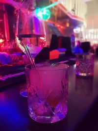 Close-up of illuminated candles on table