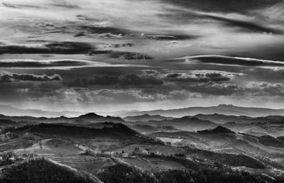 Scenic view of mountains against cloudy sky