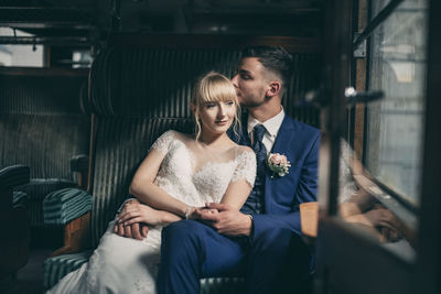 Young couple sitting at home