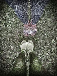 Low section of woman standing on tiled floor