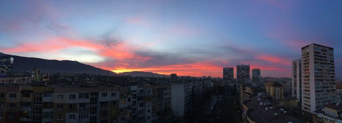 Cityscape against sky at sunset